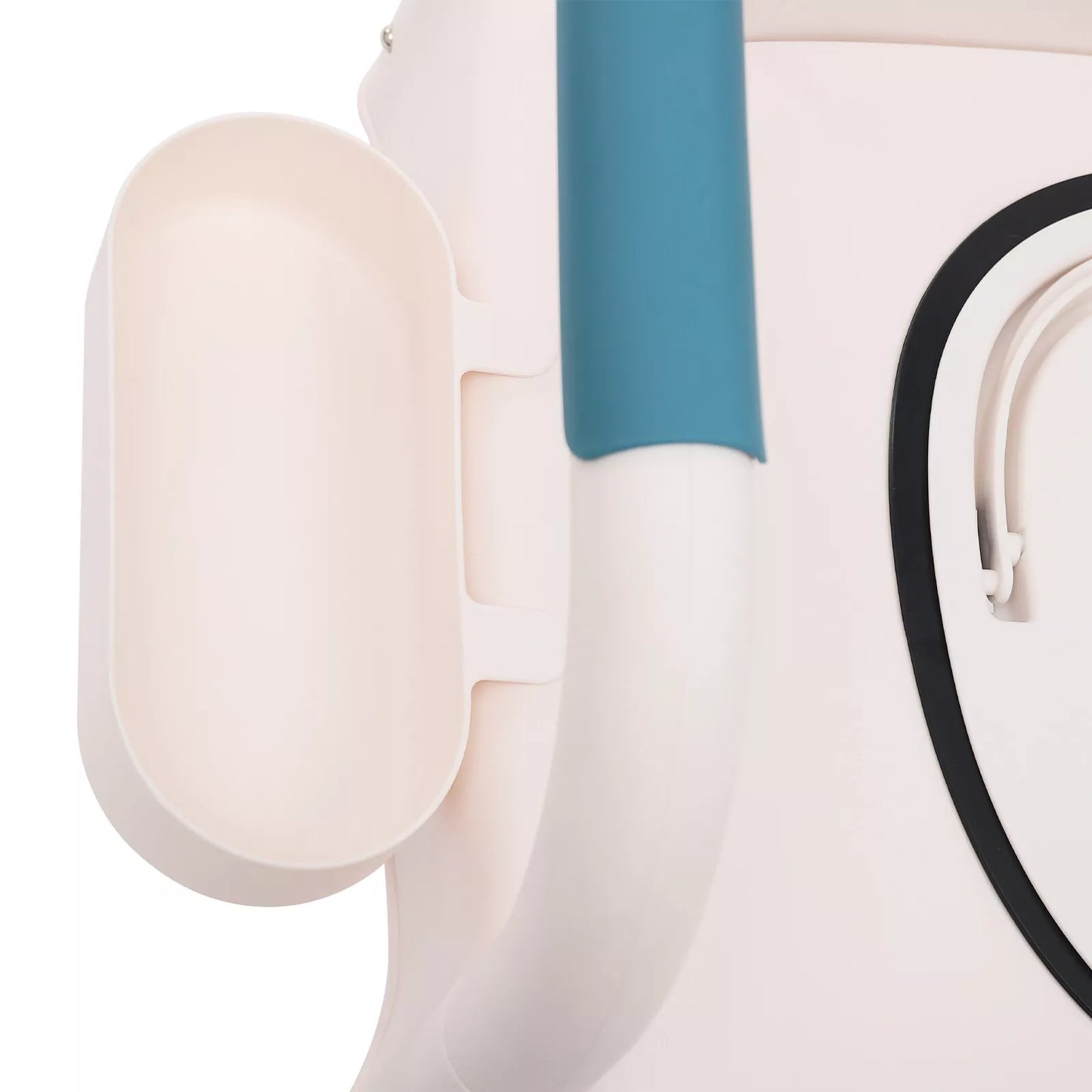 Close-up of commode side shield and teal armrest on a white chair frame