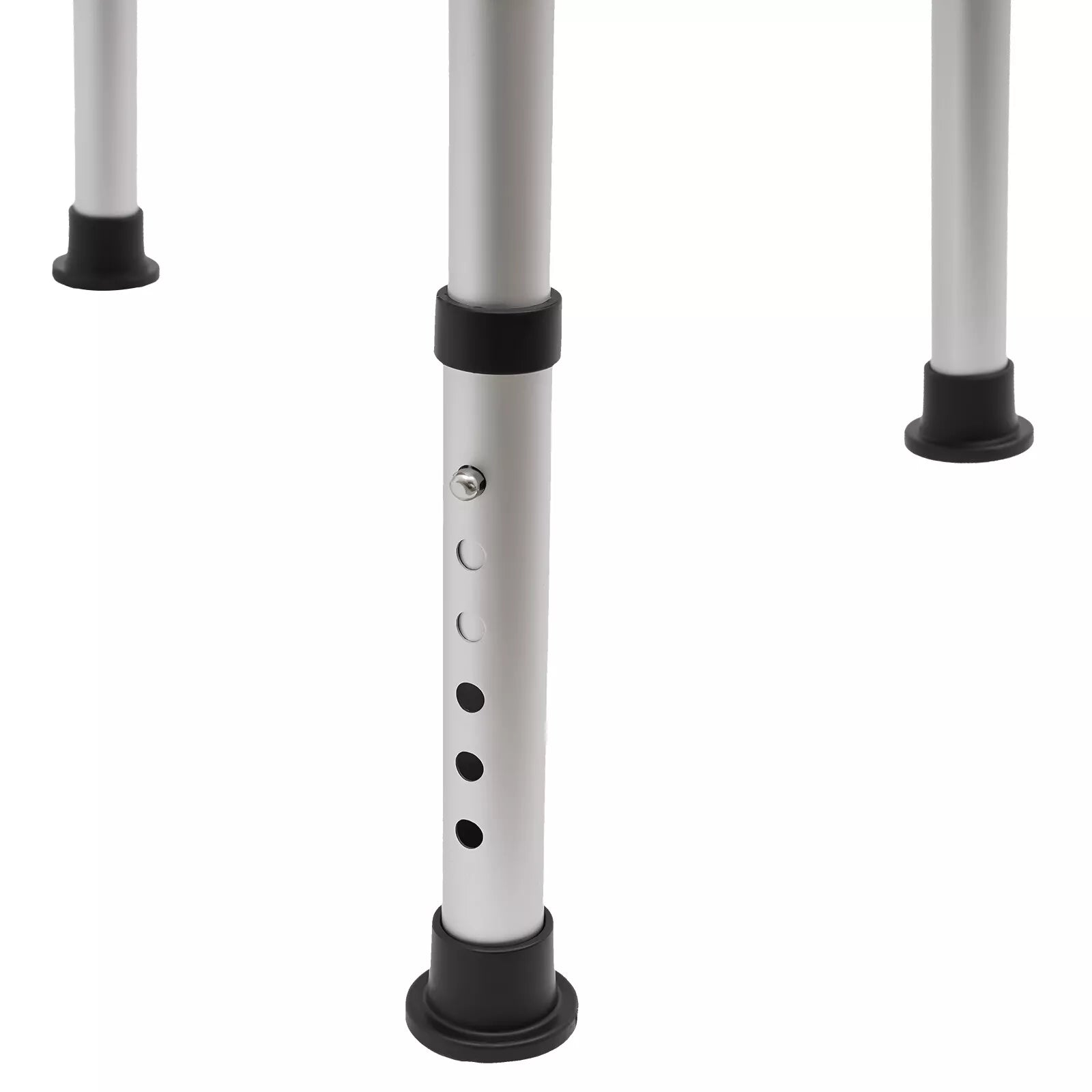 Close-up of commode chair legs with adjustable height holes and black foot bases
