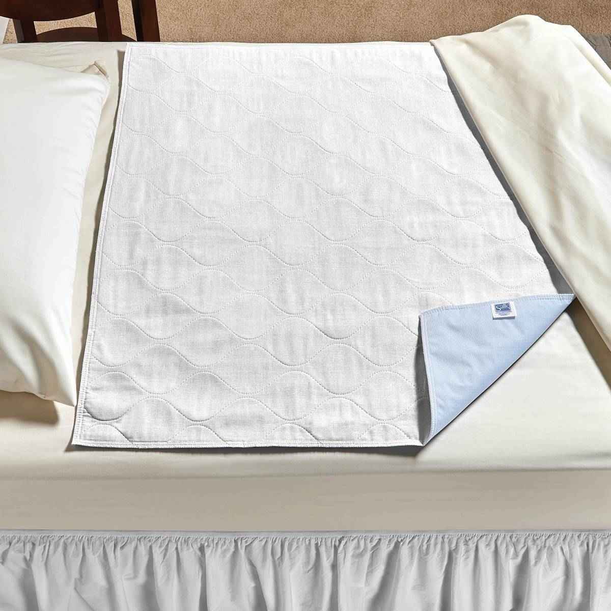 White quilted underpad with blue drawsheet flap corner, economy care underpad