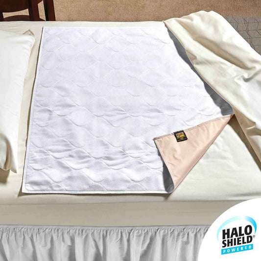 White quilted underpad with pink backing corner tag and folded edge