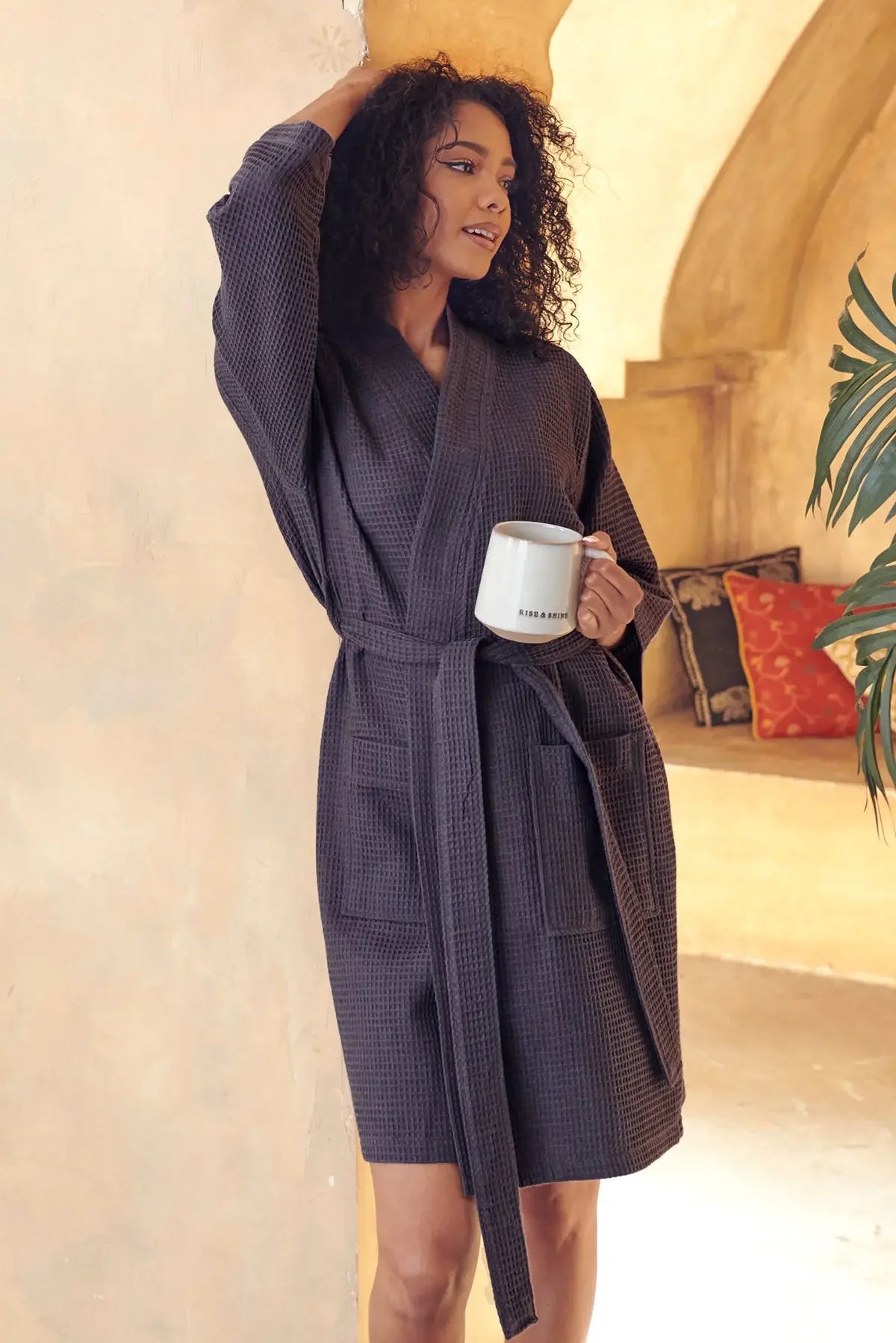 Women’s knee-length dark waffle robe with belted waist and textured waffle weave