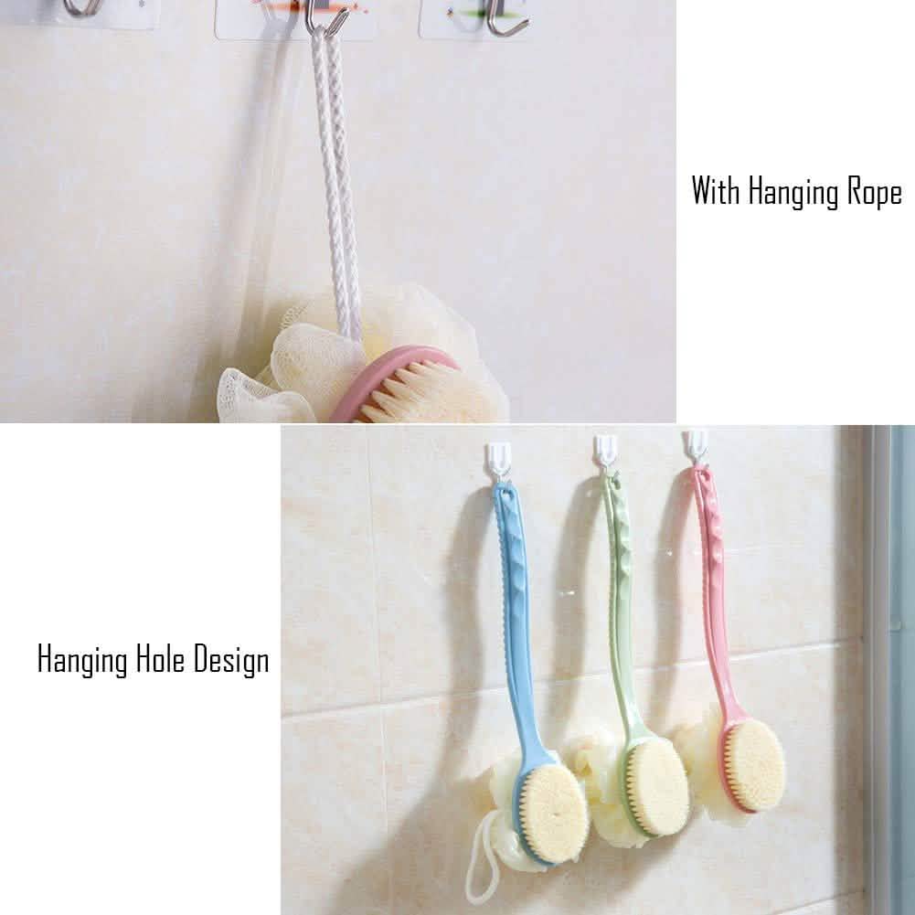 Bathroom cleaning tools with hanging rope and holes on a tiled wall.