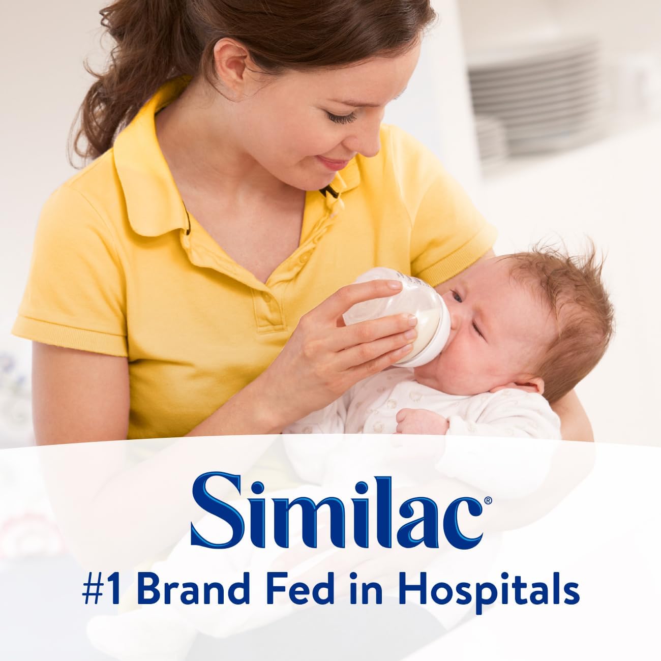 Parent feeding a newborn with Similac NeoSure ready-to-feed bottle, 32 fl oz