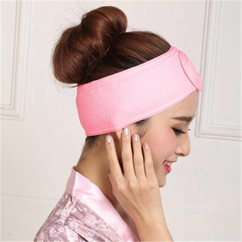 Pink terry toweling headband for face washing, soft wide band.