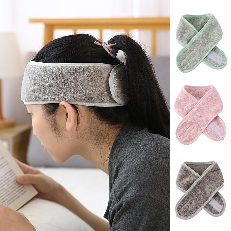 Gray terry toweling headband worn for face washing, adjustable spa band.