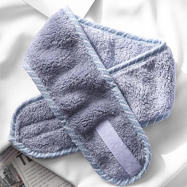 Light blue terry cloth face-washing headband with pale center stripe