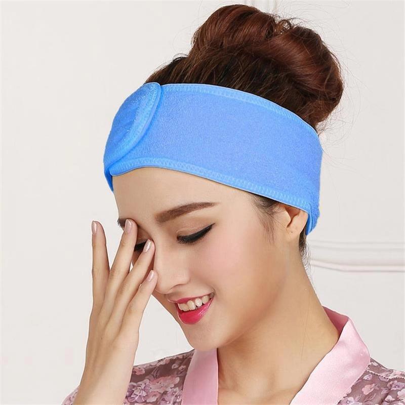 Blue terry toweling headband for face washing, soft wide band.