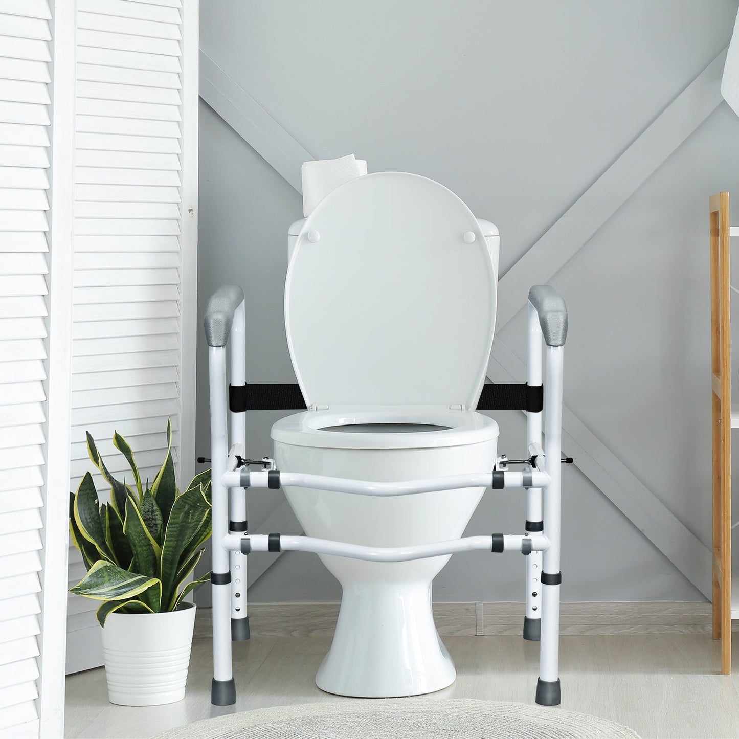 Toilet safety rail with rear mounting, white frame, and black stabilizing strap