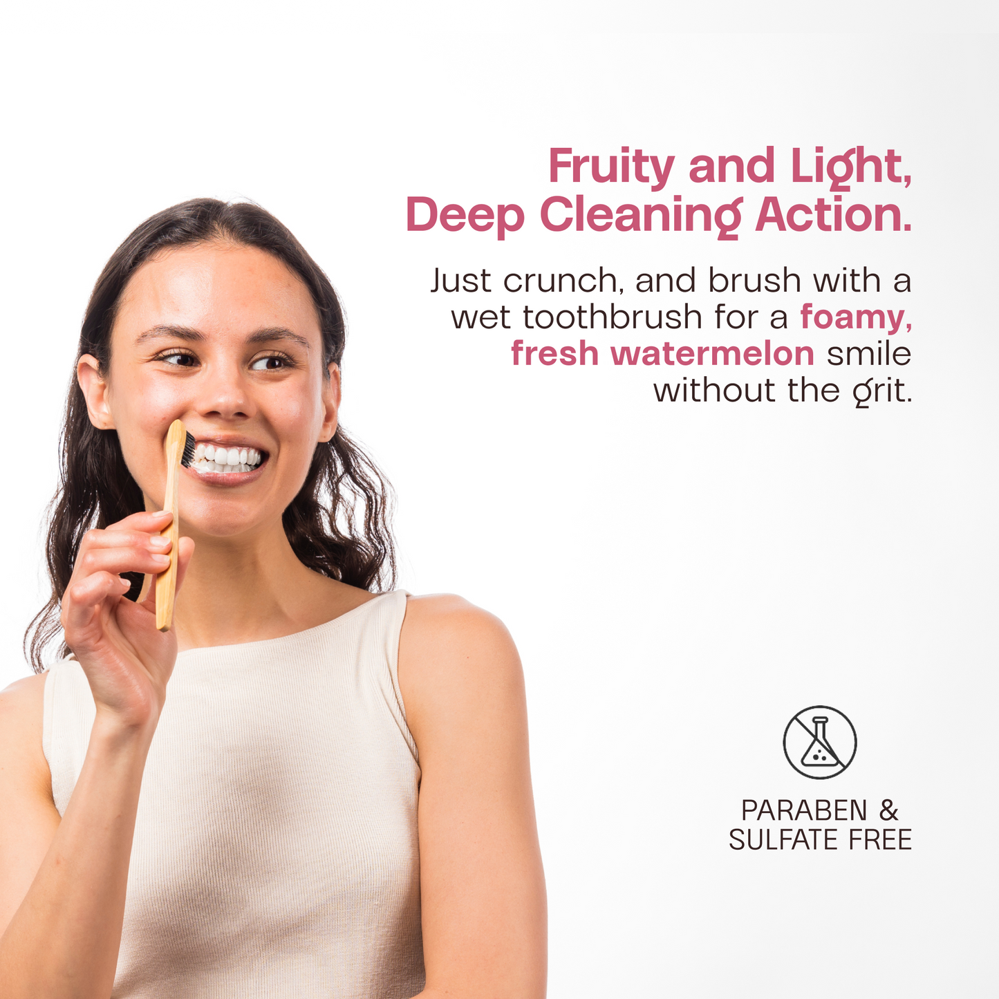 Smiling woman brushing teeth with a toothbrush