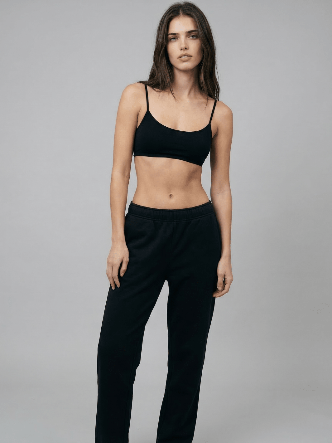 Black straight-leg sweatpants with elastic waistband and straight, relaxed legs