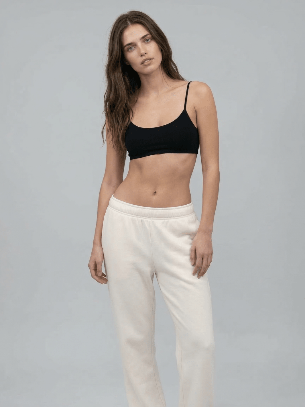 White straight-leg sweatpants with elastic waistband and straight relaxed silhouette