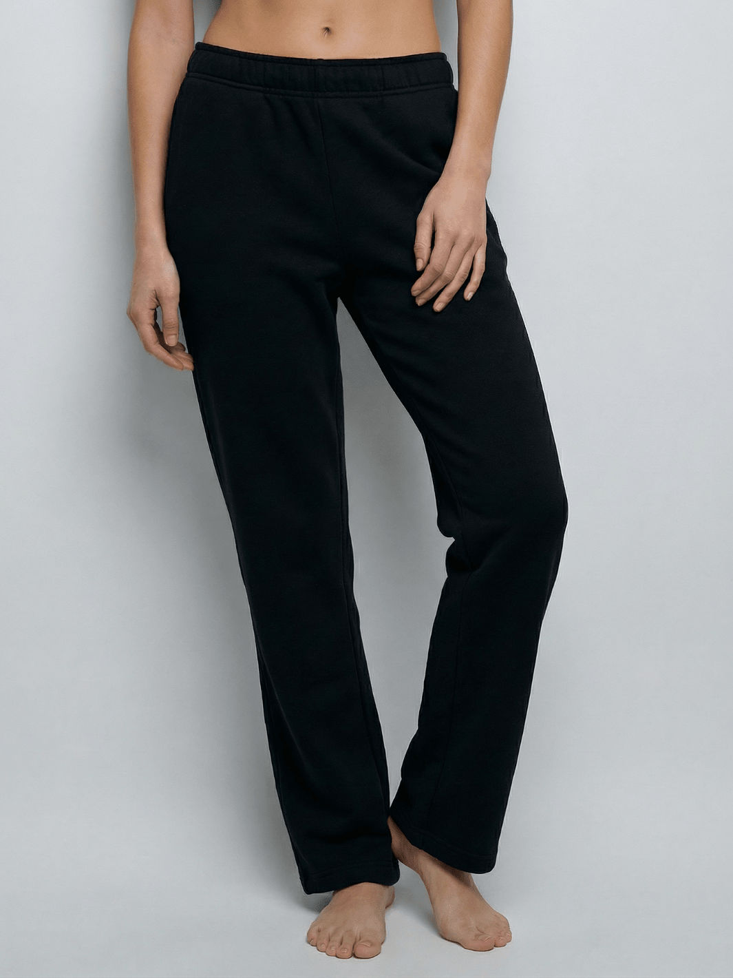 Black straight-leg sweatpants with elastic waistband and ankle-length cuffs