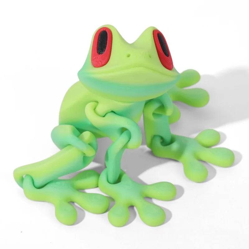 Neon green 3D printed magnetic frog toy with red oval eyes and four extended legs.