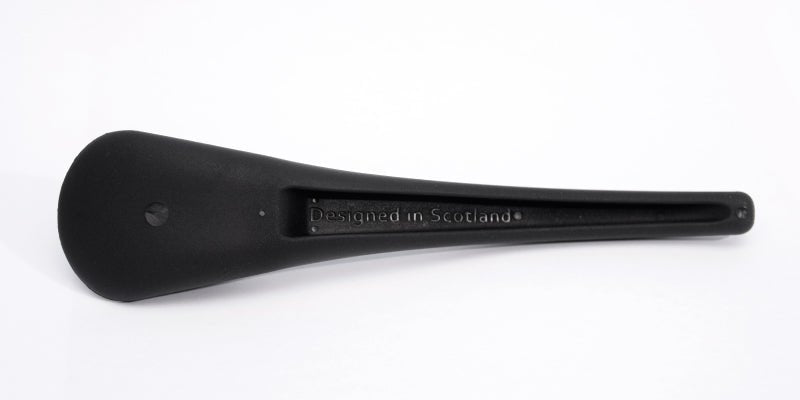 Black S'up spoon handle with 'Designed in Scotland' marking