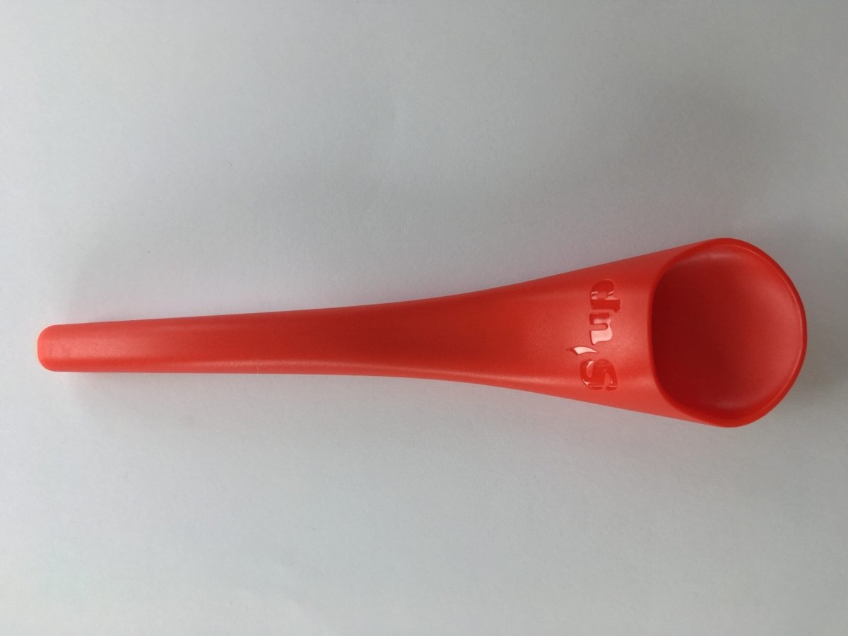 Red S'up spoon with long handle and rounded deep scoop end