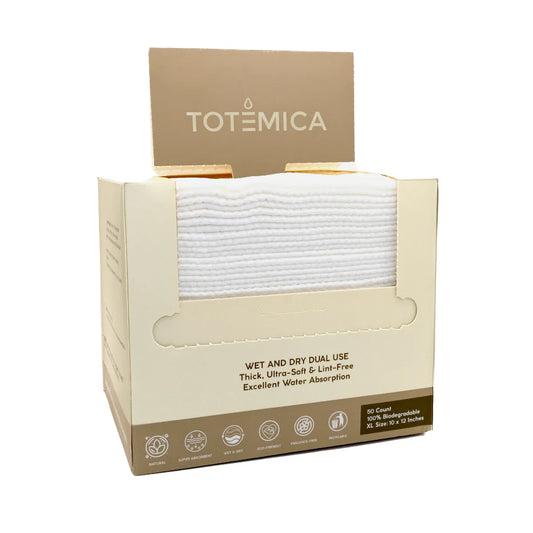 White face towels stacked in an open Totemica box package