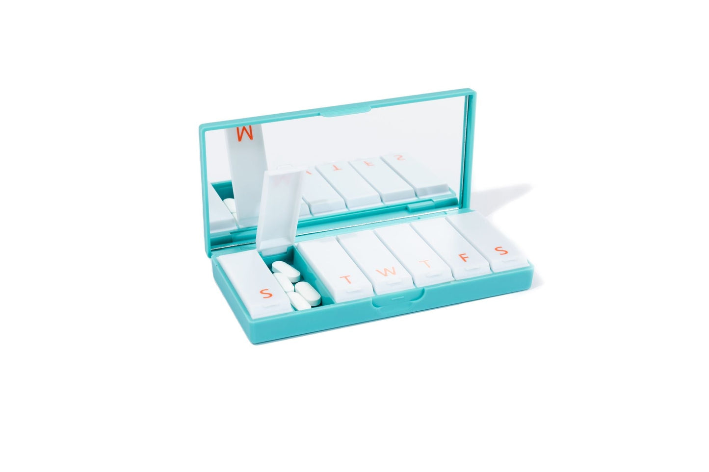 Teal pill box with open lid and lettered slots for weekly medication