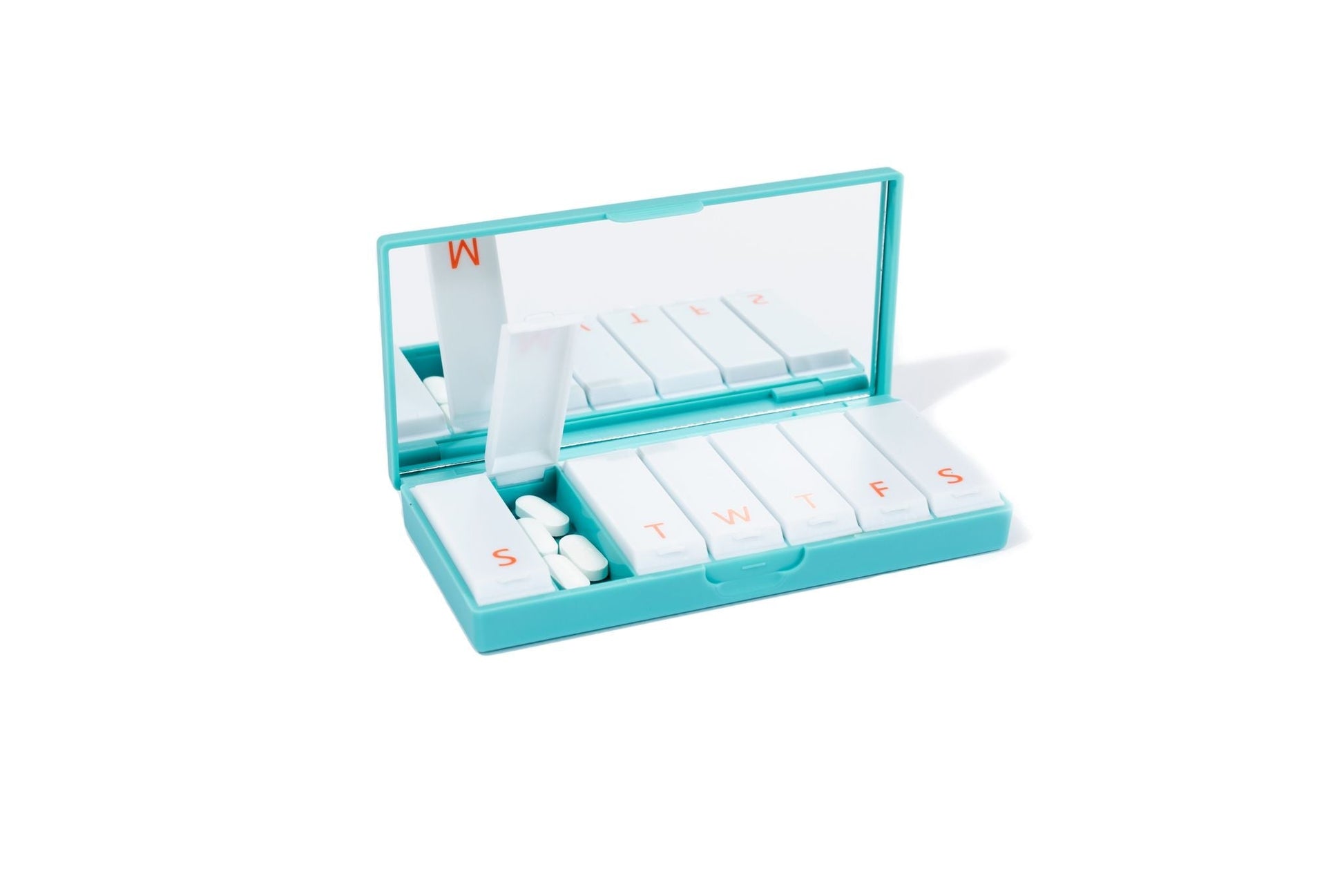 Teal pill box with open lid and lettered slots for weekly medication