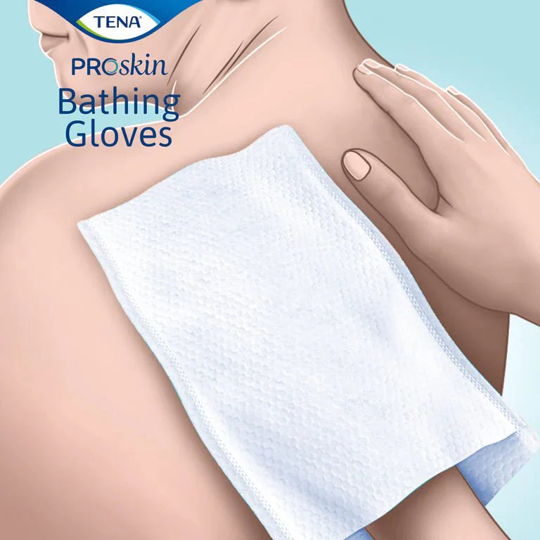Folded white pre-moistened bathing glove cloth, textured nonwoven