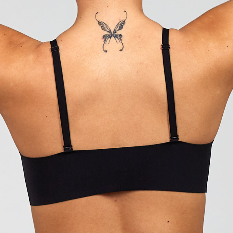 Black bra back view with wide band and adjustable shoulder straps