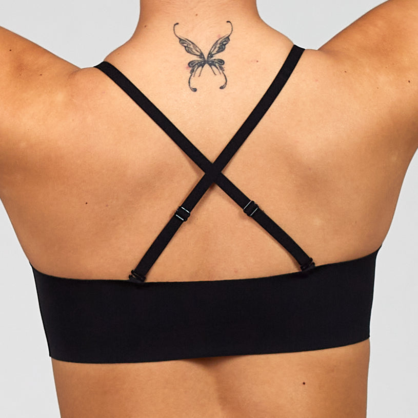 Black adjustable bra with crossed back straps and low, wide underband