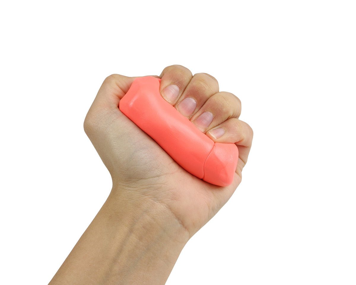 Hand squeezing a coral-pink Theraputty resistance exercise putty bar.
