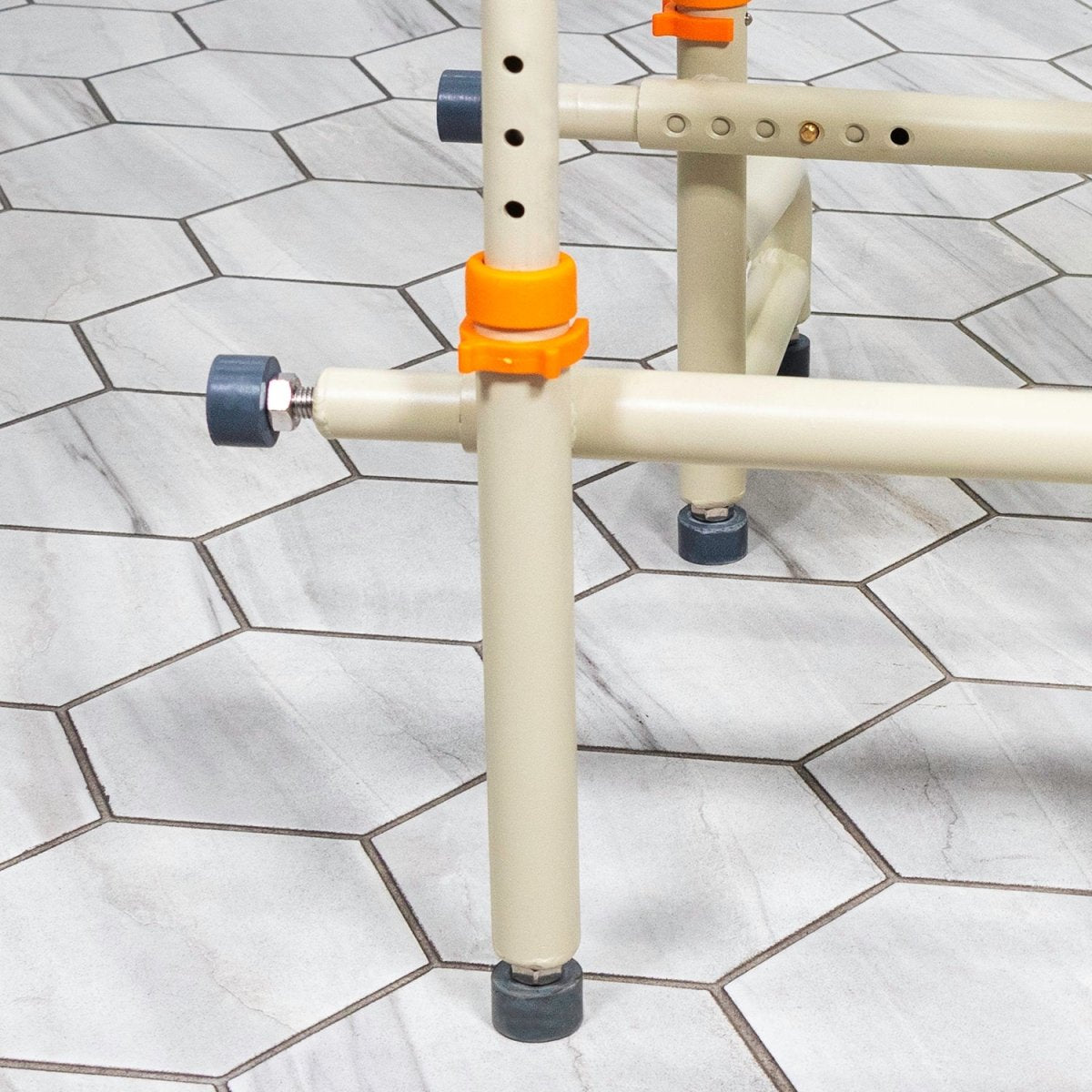 Over-the-bath shower chair frame with height-adjustable legs and anti-slip feet