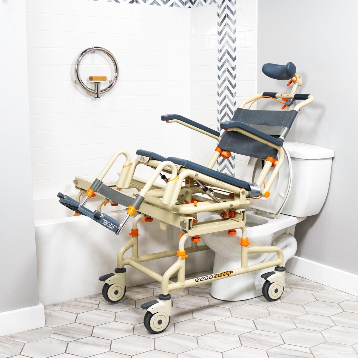 Tilt-over-bath shower chair with dark blue cushions, curved support frame, and caster wheels