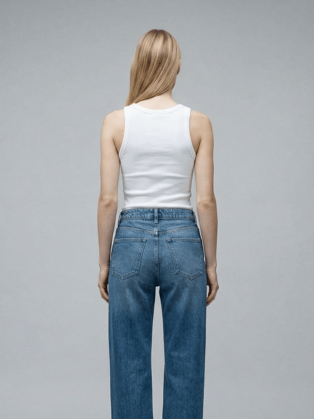 White ribbed tank top with scoop back and sleeveless cut
