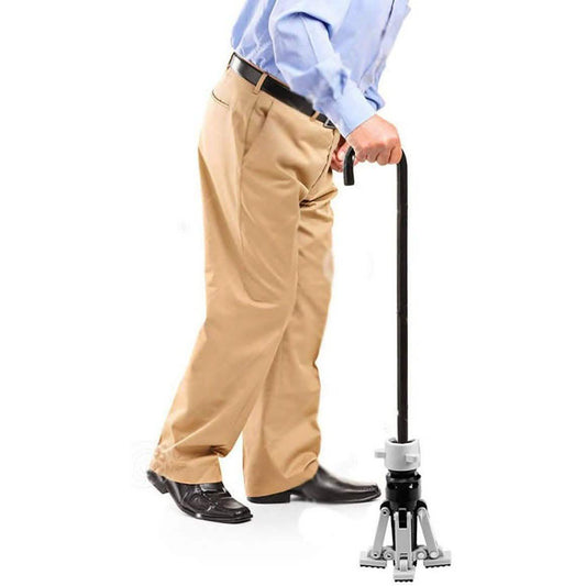 Walking stick held upright with spring-loaded rubber foot on gray stand base