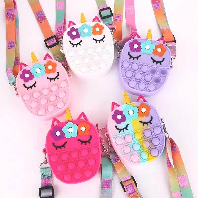 Assorted unicorn fidget pop crossbody bags, cute face and rainbow webbing straps