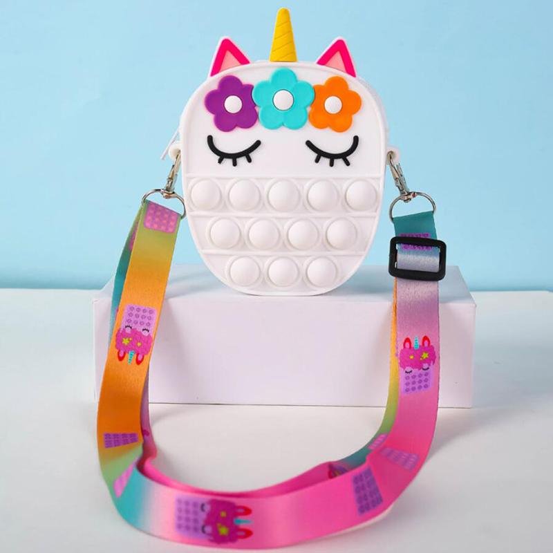 White unicorn fidget pop crossbody bag with flower hair and rainbow strap