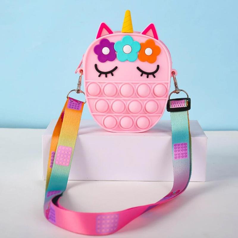 Pink unicorn fidget pop crossbody bag with flower hair, horn, and rainbow strap