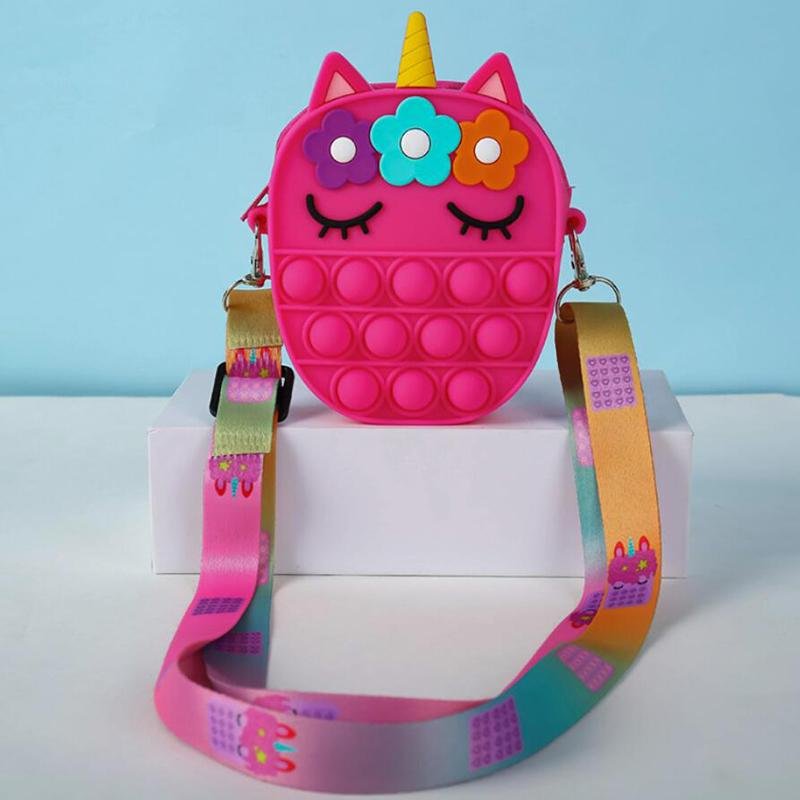Hot pink unicorn fidget pop crossbody bag with flower hair and rainbow strap