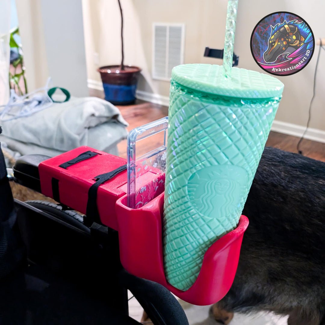 Wheelchair cup and phone holder in red, attached to a wheelchair armrest, holding a large turquoise tumbler.