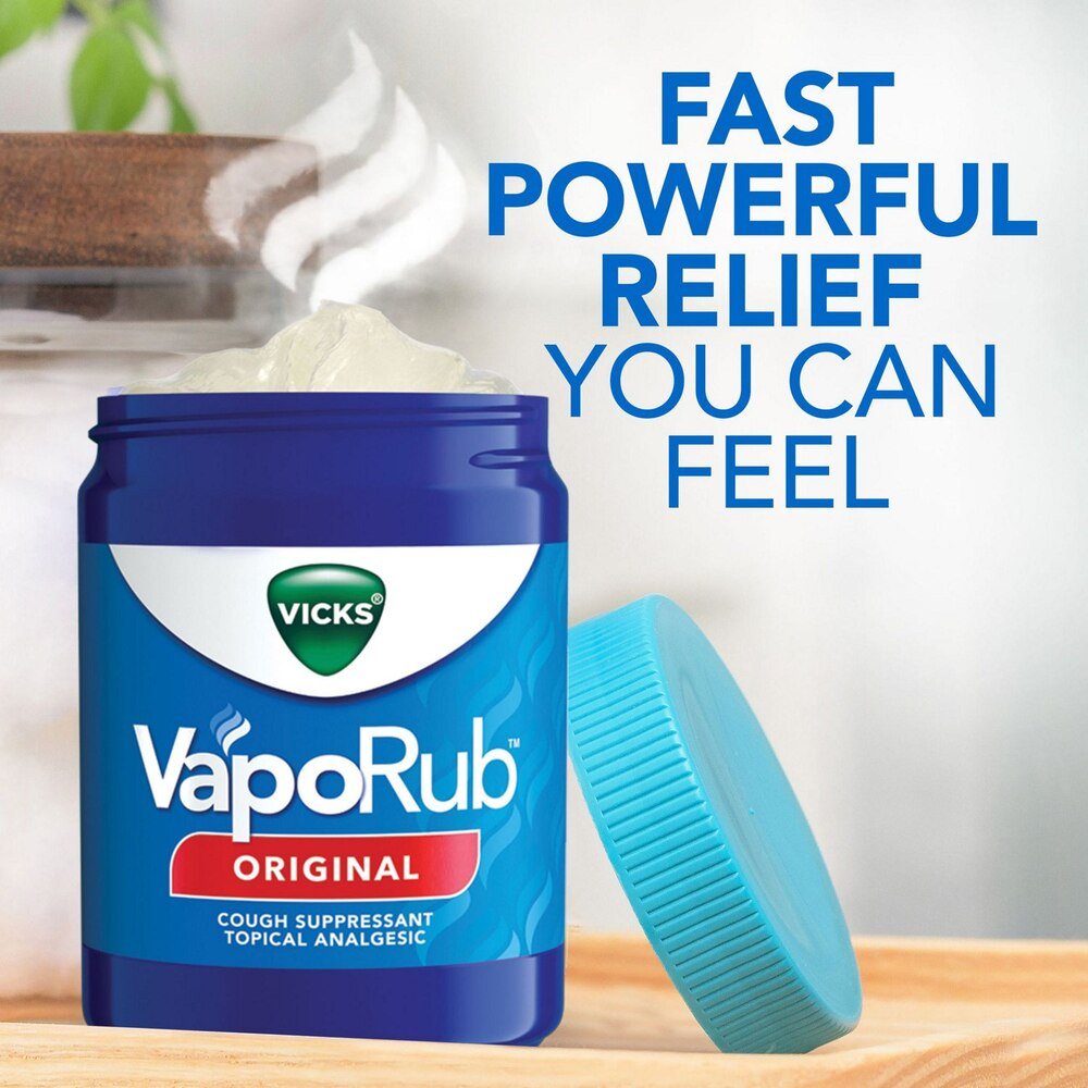 VapoRub Original ointment jar with teal applicator, fast powerful relief text