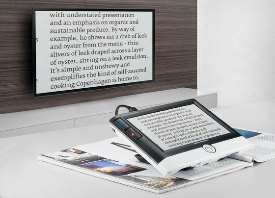 Visolux Digital tablet on desk with on-screen text, shown at an angled view
