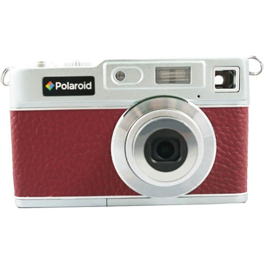 Retro digital camera front view with large circular lens and red textured grip.