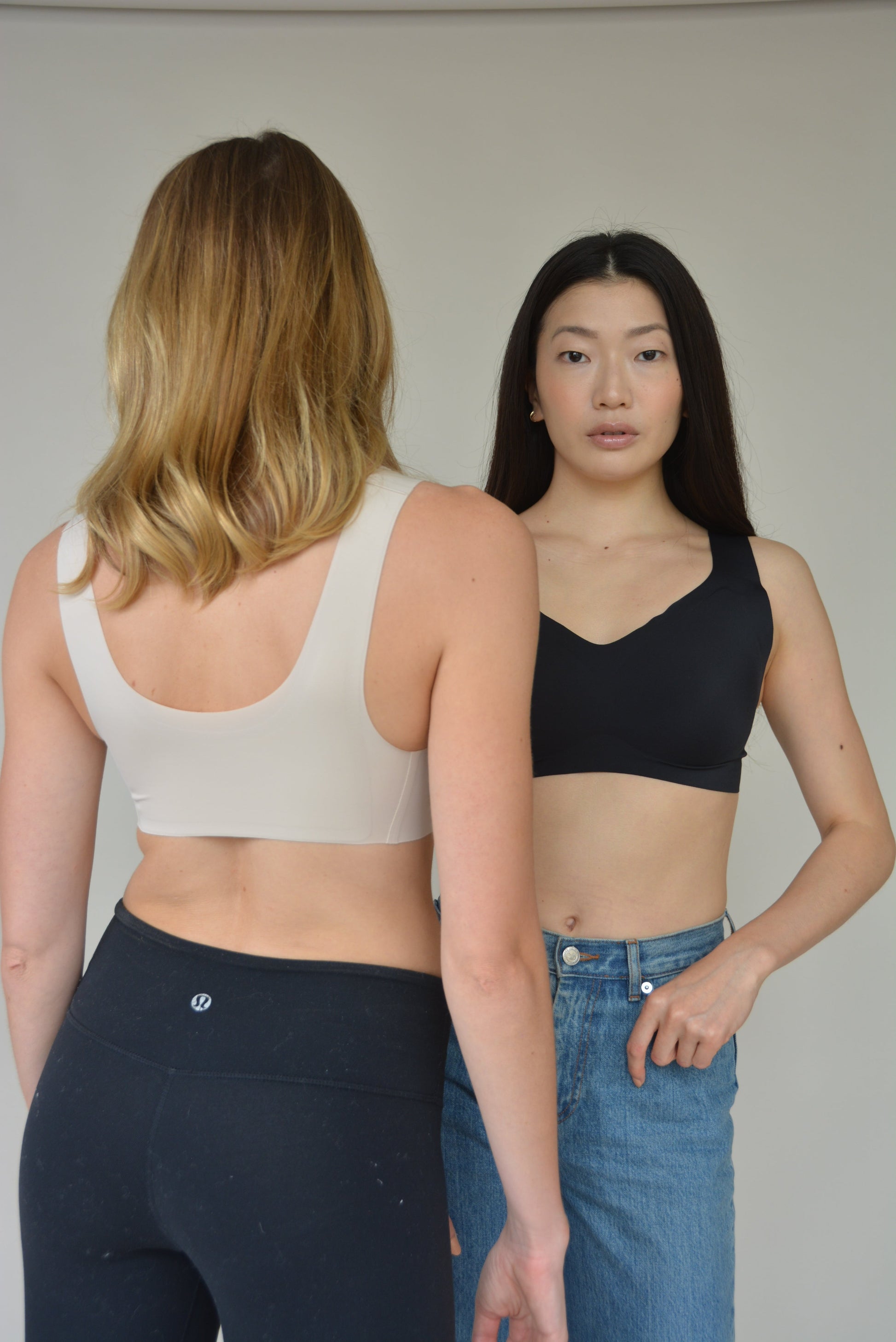 Black and white v-neck lift bras with wide straps and molded cups.