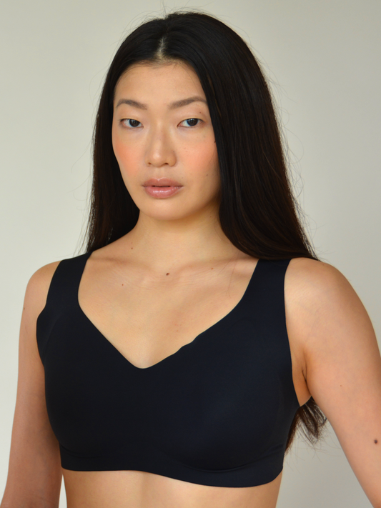 Black v-neck lift bra with smooth cups and wide straps.