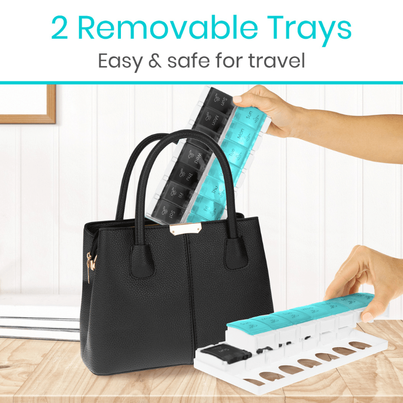 Weekly pill organizer with removable trays; hand holds a turquoise tray for travel