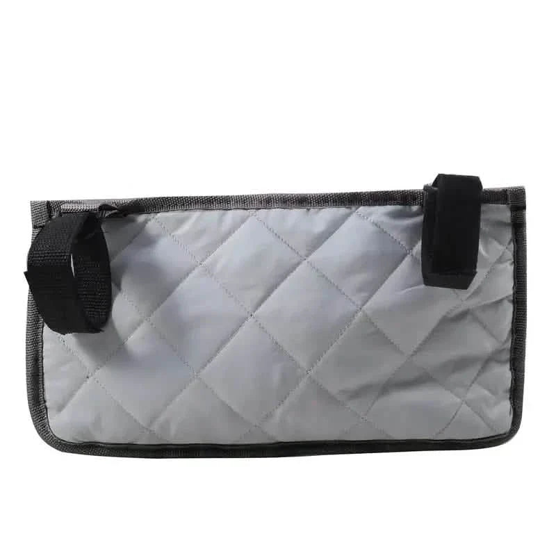 Wheelchair armrest organizer bag in light gray with quilted front and black straps