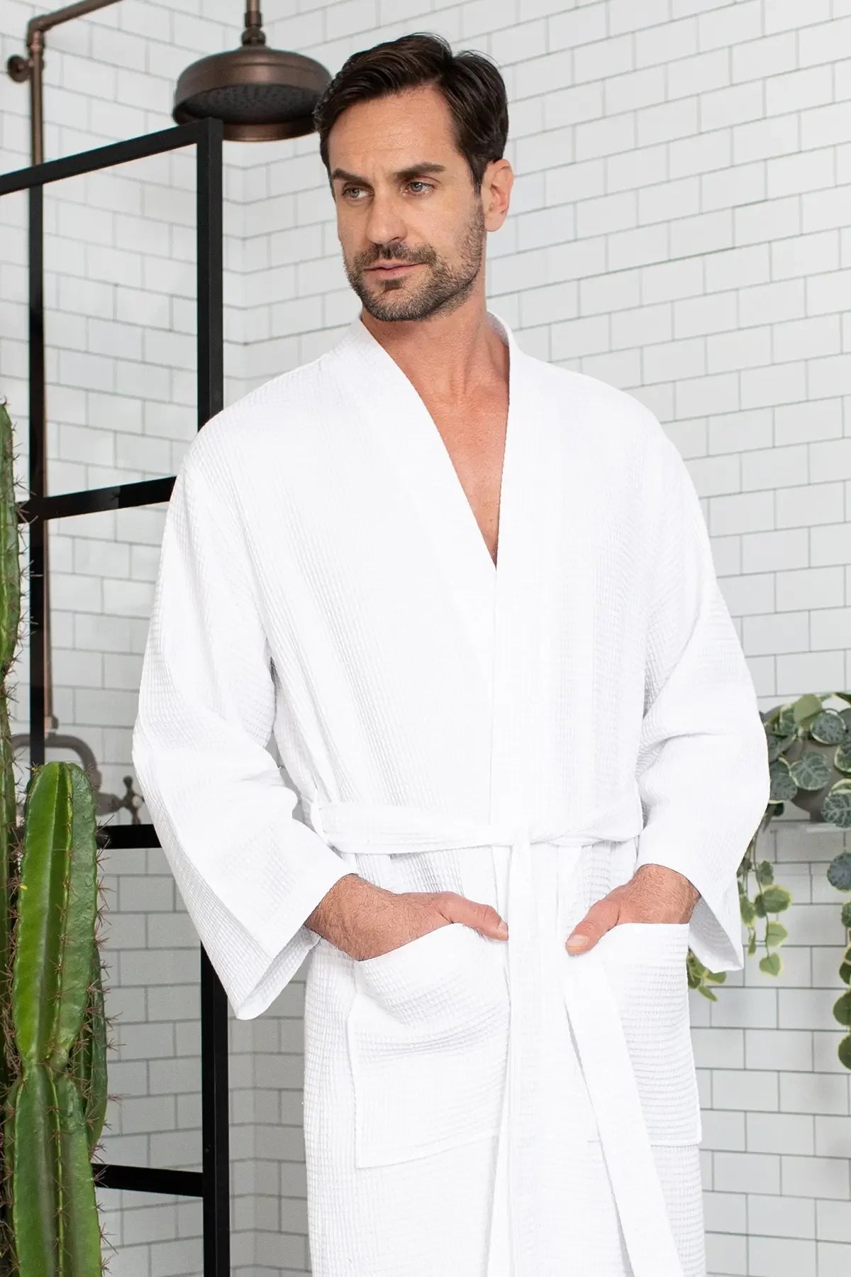 Men's waffle spa bathrobe in white, V-neck waffle-knit with belt and front pocket.